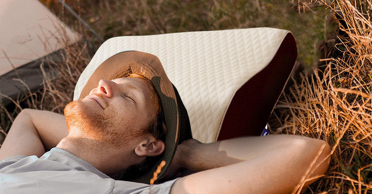 Man relaxing comfortably outdoors with Derila ergonomic memory foam pillow