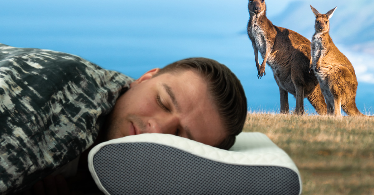 Man sleeping on side using Derila memory foam pillow with contoured cervical support